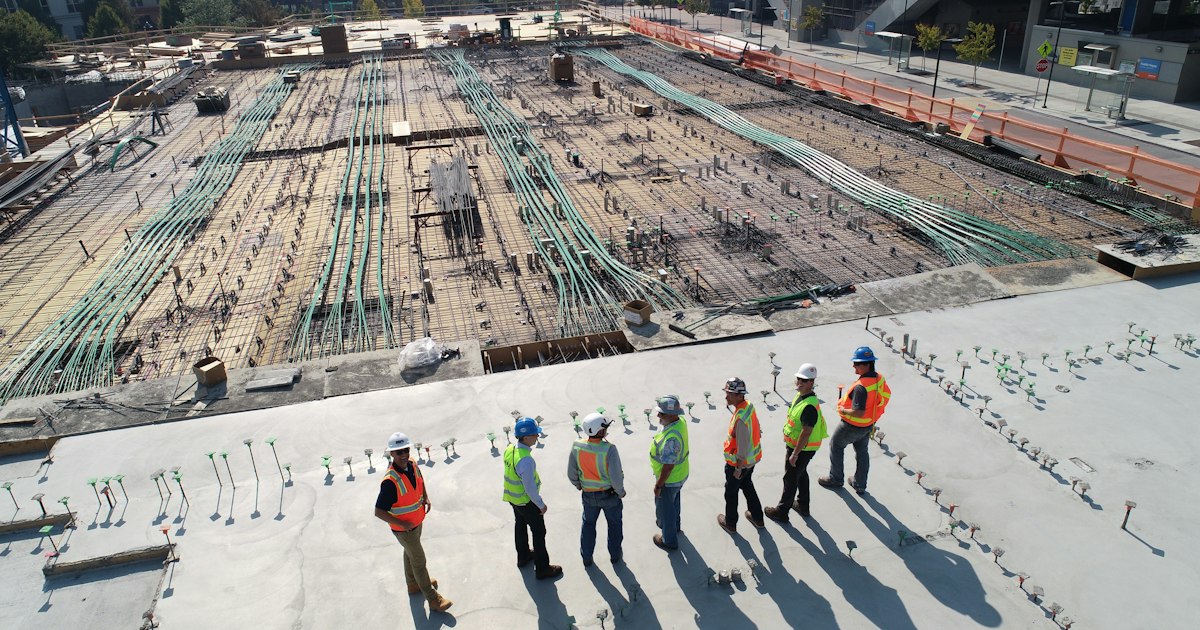 Construction site with a tower crane and building structure under development