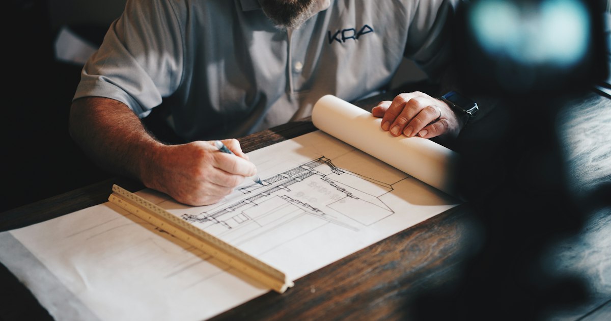 Engineers and architects reviewing coordinated building design on-site