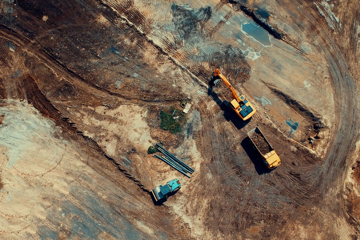 Aerial photo of heavy construction equipment working across an active site development project