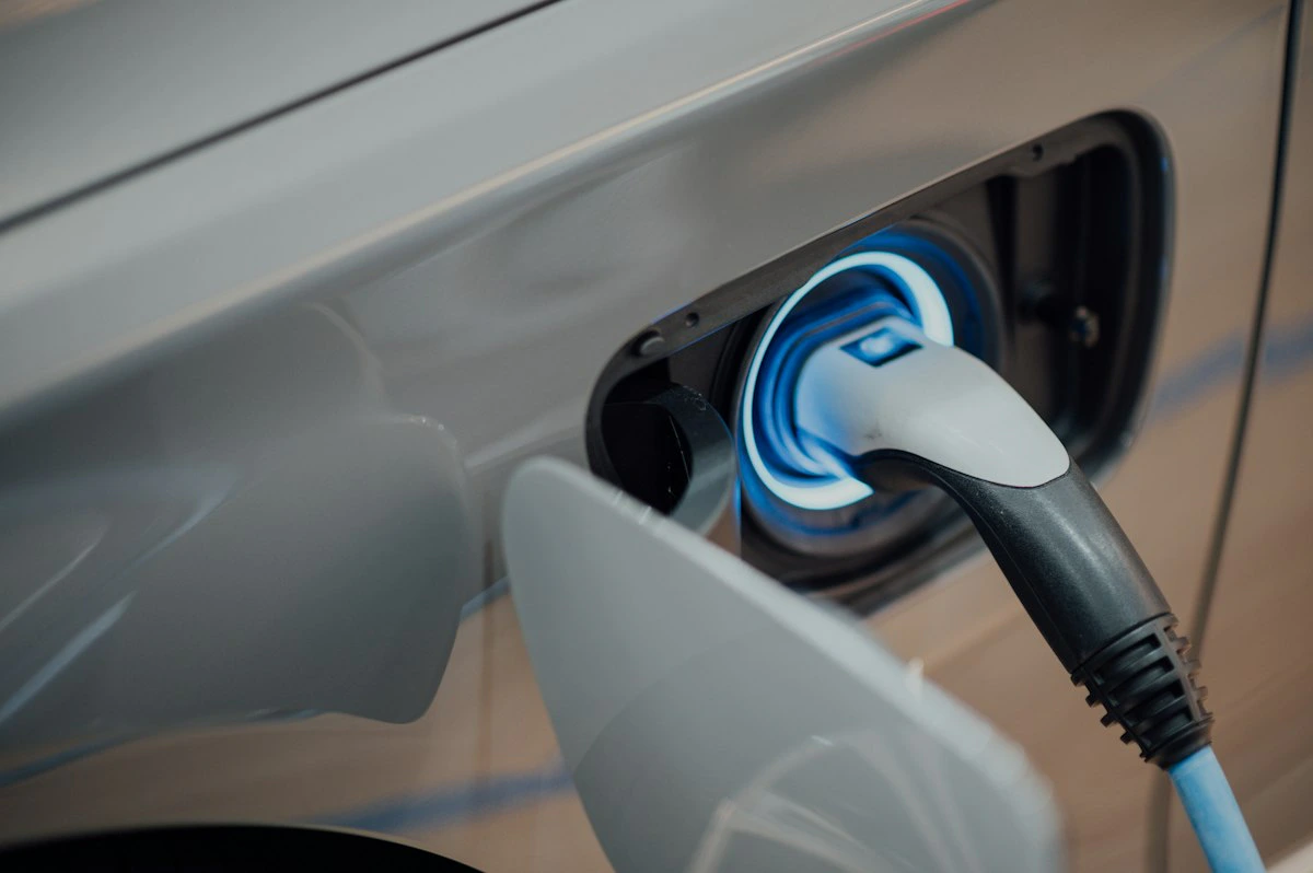 Electric vehicle charging station at a parking area