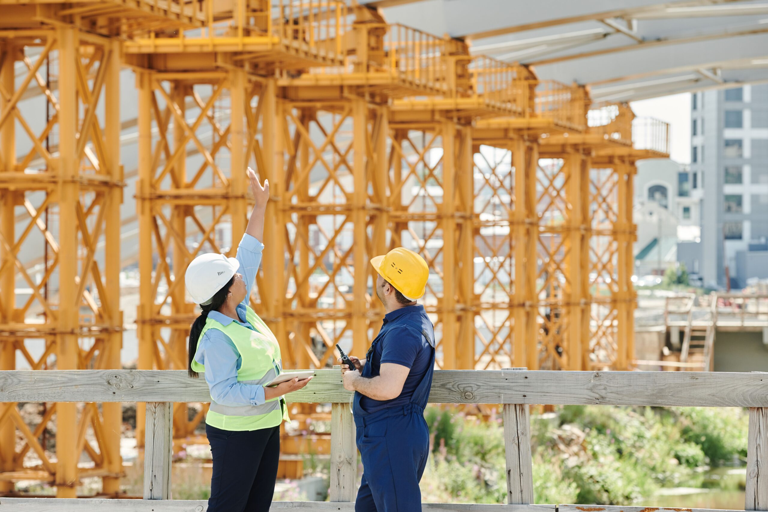Engineer reviewing construction plans and building system drawings